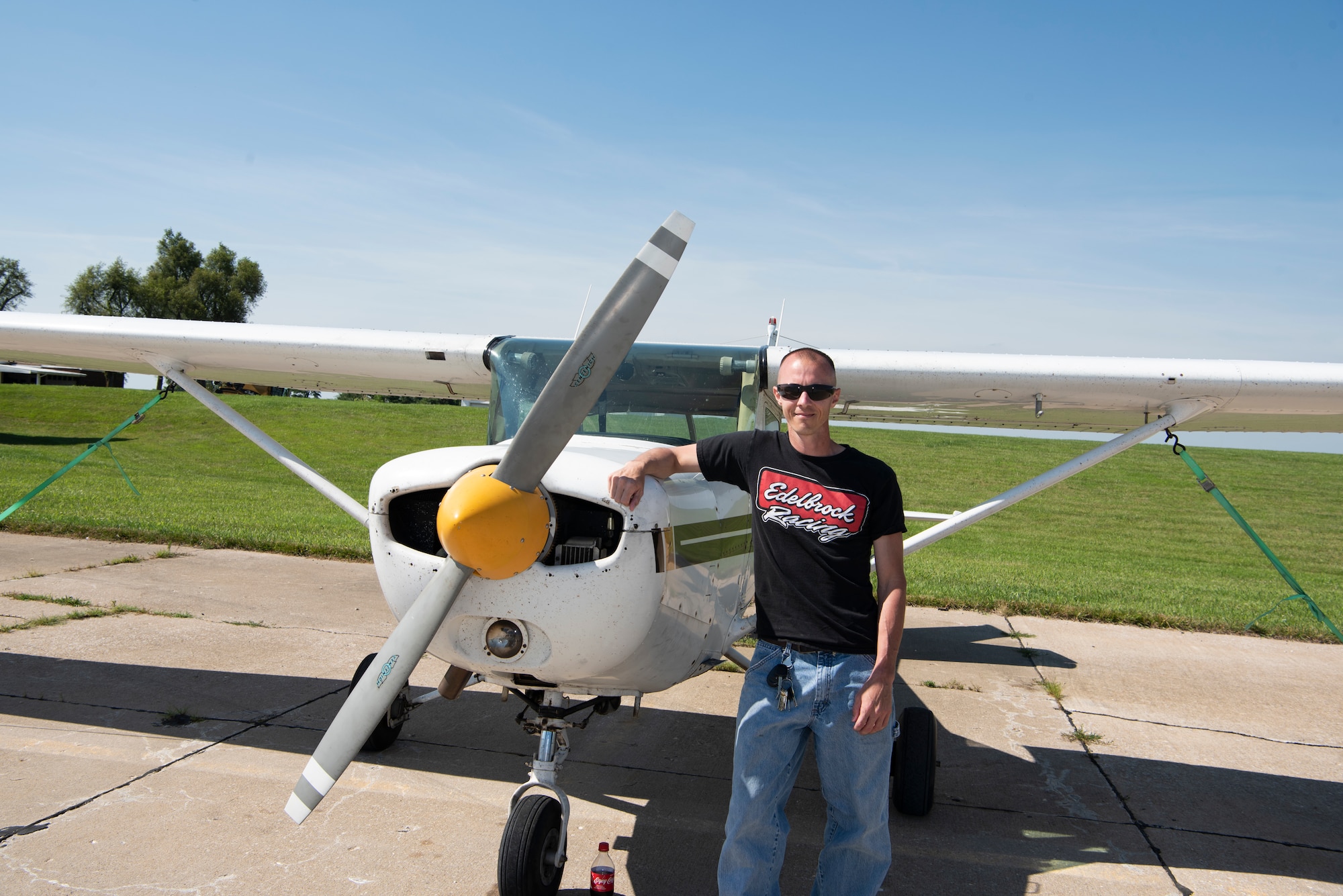 Staff Sgt. Matthew Lewis, an aerospace ground equipment technician with the 509th Maintenance Squadron and the outgoing president of the Whiteman Aviation Club, poses for a photo in front of a Cessna 152 on July 13, 2019, at the Sedalia Regional Airport in Sedalia, Missouri. Lewis founded the club in November 2018. (U.S. Air Force Photo by Airman 1st Class Parker J. McCauley)