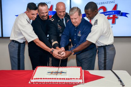 From left, Cadet Capt. Christian Falk, U.S. Military Academy; James Skibo, Exchange senior vice president; Maj. Gen. David C. Coburn, U.S. Army Financial Management Command commanding general; Tom Shull, Exchange director and CEO; and Cadet Capt. Thomas Bordeaux, U.S. Military Academy, cut a ceremonial cake in celebration of the Exchange’s 124th anniversary. As the Department of Defense’s largest retailer, the Exchange has a commitment to taking care of warfighters, no matter where their mission takes them.