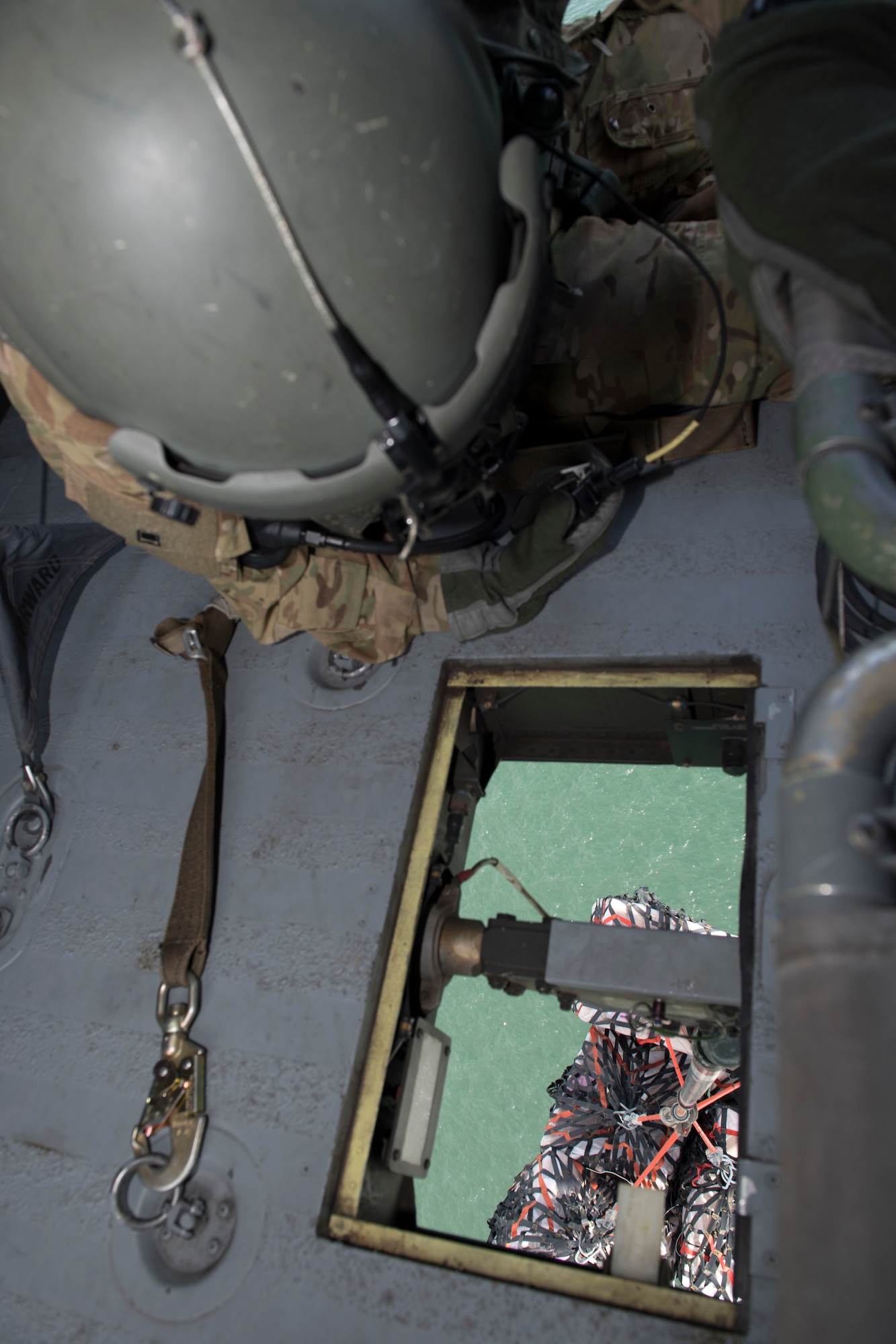 A UH-60 Blackhawk crew chief assigned to the 1st Battalion, 228th Aviation Regiment monitors a load of medical equipment and supplies in transit to Punta Arenas, Costa Rica, July 21, 2019. Pilots and aircrew assigned to the 1st Battalion, 228th Aviation transported personnel and equipment to allow the U.S. Naval Ship Comfort to provide medical care to Costa Rican citizens and Venezuelan migrants as part of the United States enduring promise of helping its southern neighbors. The Winged Warriors transported more than 470 people and 20 tons of cargo from July 21 - 30. (U.S. Air Force photo by Staff Sgt. Eric Summers Jr.)