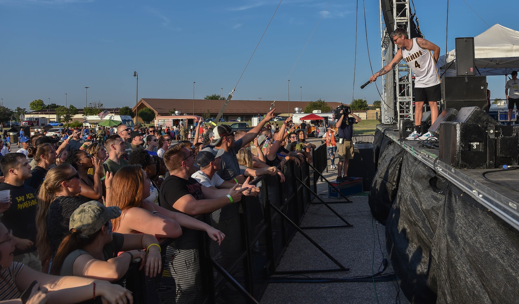 Sean Foreman, 3OH!3 vocalist, performs for a live crowd
of Airmen and their families during the 2019 Summer Bash
July 26, 2019, at McConnell Air Force Base, Kan. The band
was part of the 2019 Summer Bash as a way for Airmen and their families to enjoy themselves
for working hard on the air refueling mission. (U.S. Air Force photo by Airman 1st Class Marc
A. Garcia)