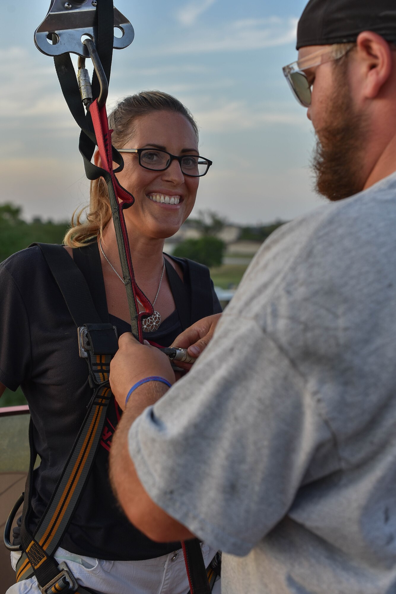 Master Sgt. Amy Watkins, Family Health flight chief, is fitted for a zipline
harness at the 2019 Summer Bash July 26, 2019, at McConnell Air Force
Base, Kan. The event was for the men and women of Team McConnell and
their families for their hard work. (U.S. Air Force photo by Airman 1st Class
Marc A. Garcia)
