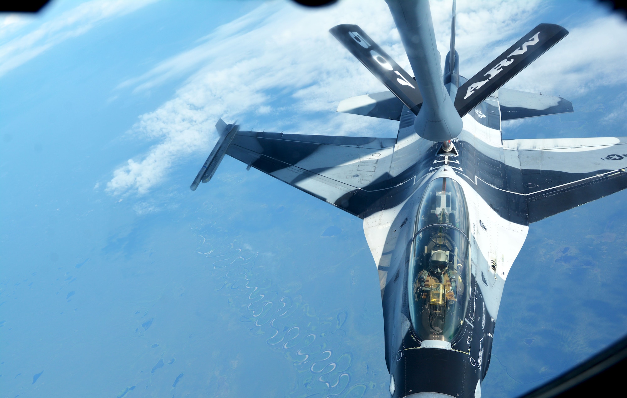 An F-16 Fighting Falcon assigned to the 18th Aggressor Squadron at Joint Base Elmendorf-Richardson, Alaska, receives fuel from a 507th Air Refueling Wing KC-135R Stratotanker July 19, 2019. (U.S. Air Force photo by Tech. Sgt. Samantha Mathison)