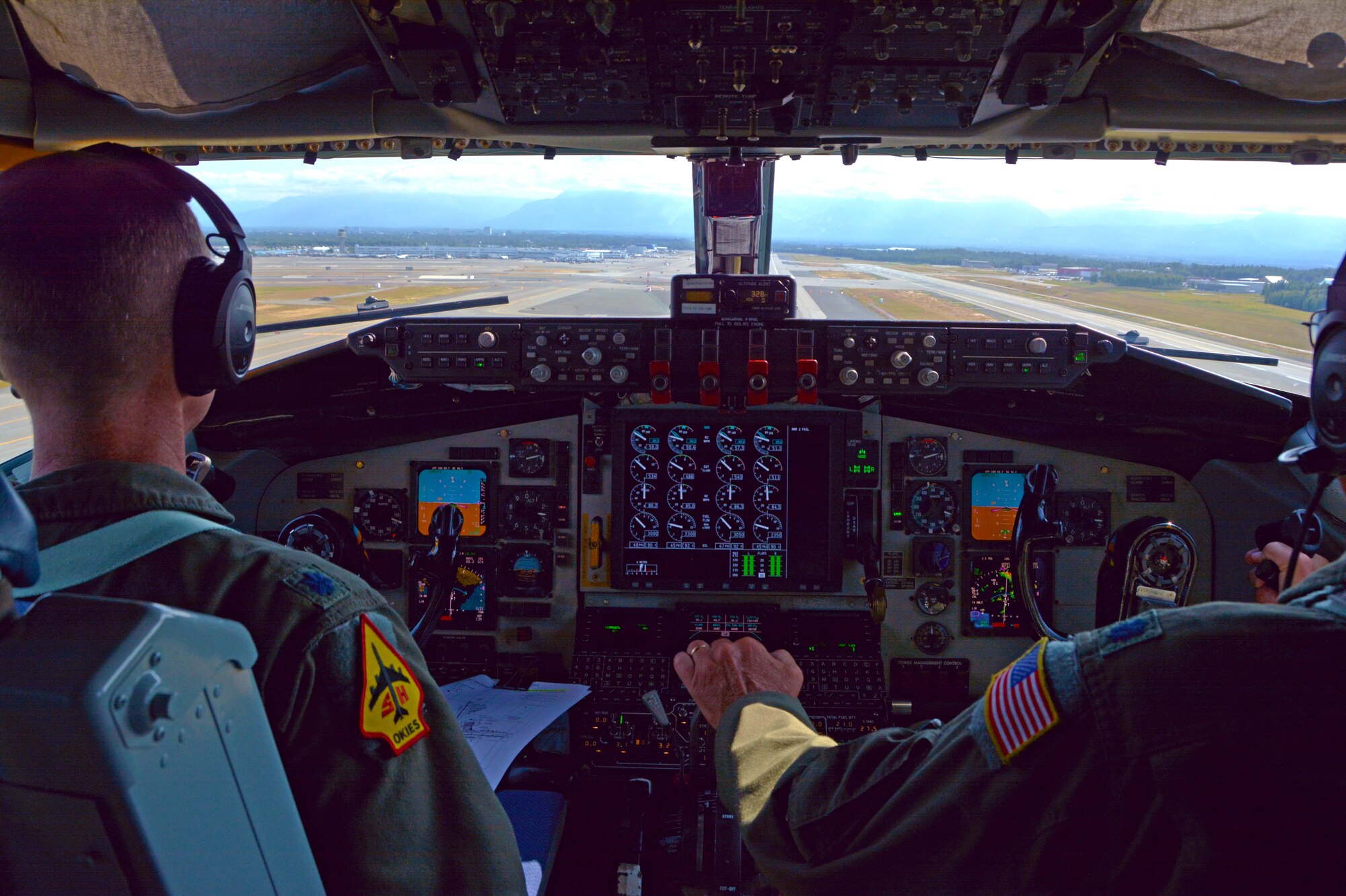 465th Air Refueling Squadron pilots, Lt. Cols. Marvin Ashbaker and Eric Wilks, guide a KC-1335R Stratotanker for landing on the runway at Ted Stevens Anchorage International Airport, Alaska, July 17, 2019. 507th Air Refueling Wing operations and maintenance Airmen were in Alaska supporting air refueling operations. (U.S. Air Force photo by Tech. Sgt. Samantha Mathison)