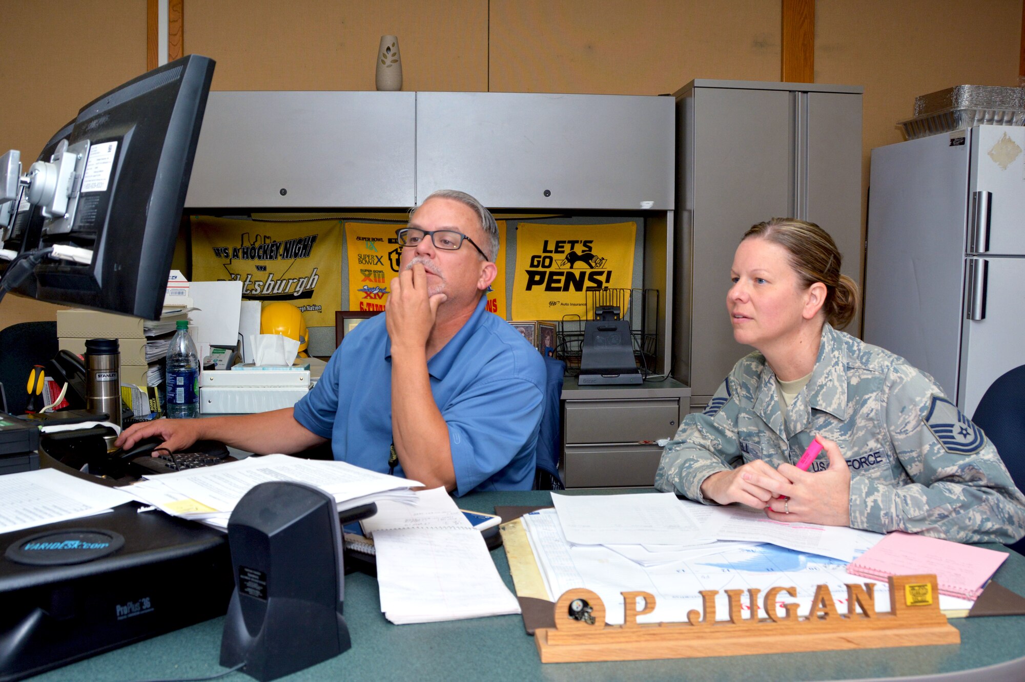 Master Sgt. Heather Bell, 507th Logistics Readiness Squadron Quality Assurance superintendent, goes over QA processes with Paul Jugan, 673rd Logistics Readiness Squadron Quality Assurance evaluator, July 18, 2019, at Joint Base Elmendorf-Richardson, Alaska. (U.S. Air Force photo by Tech. Sgt. Samantha Mathison)