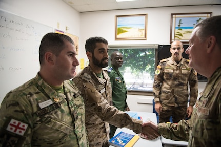 U.S. Air Force Lt. Gen. Brad Webb (right), commander of Air Education and Training Command (AETC), shakes hands with international students during his immersion tour at the 637th Training Group at Defense Language Institute English Language Center Aug. 1, 2019, at Joint Base San Antonio-Lackland, Texas.