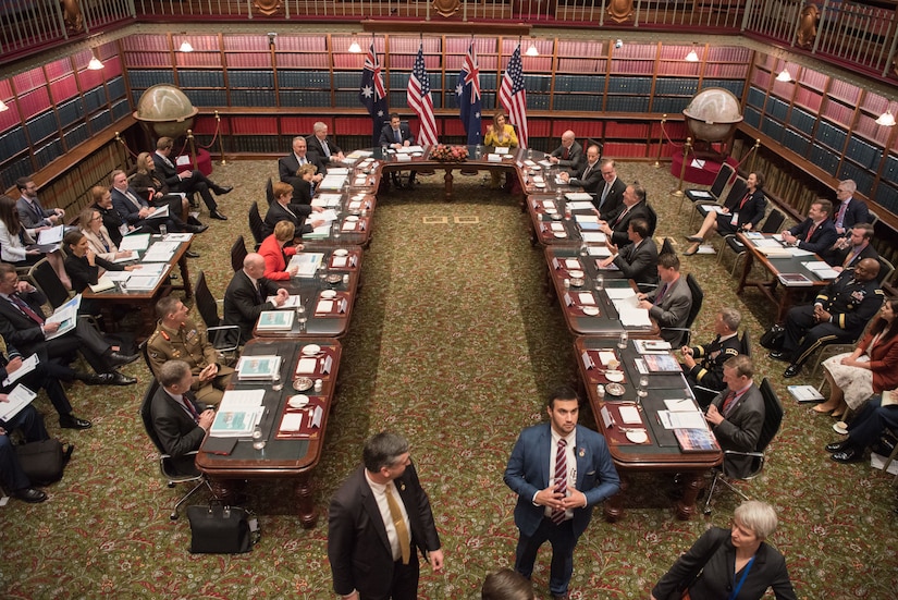 Large group of people sitting around a table.