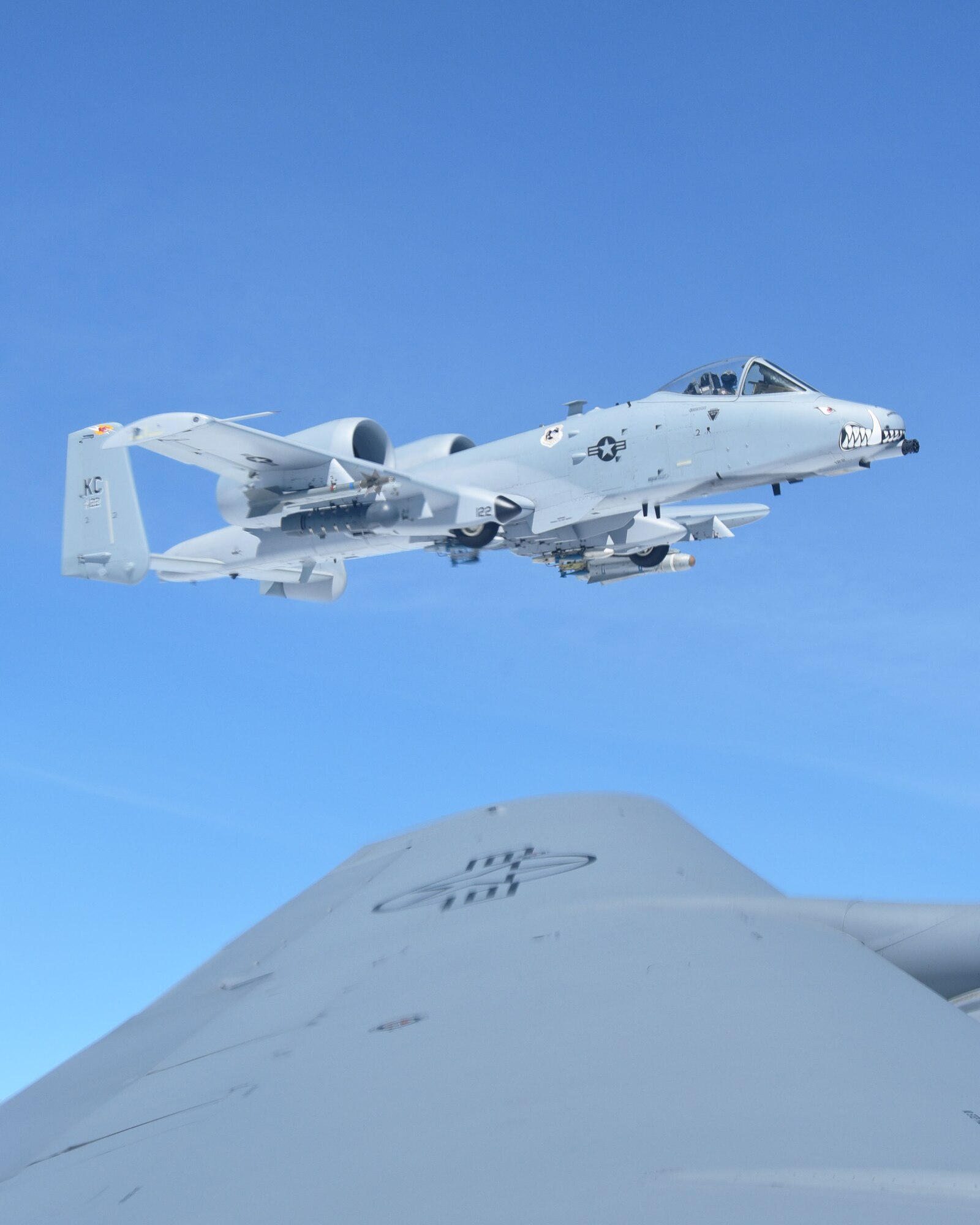 An A-10 Thunderbolt from the 442nd Fighter Wing at Whiteman AFB, Mo., flys close to the wing of a KC-135 Stratotanker assigned to McConnell Air Force Base, Kan., during a "Bosslift" sponsored by the local Employer Support of the Guard and Reserve, Aug. 3, 2019.  During the flight, ten civilian employers of 931st Air Refueling Wing Traditional Reservists observed the aerial refueling of the A-10s by a 931 ARW aircrew.