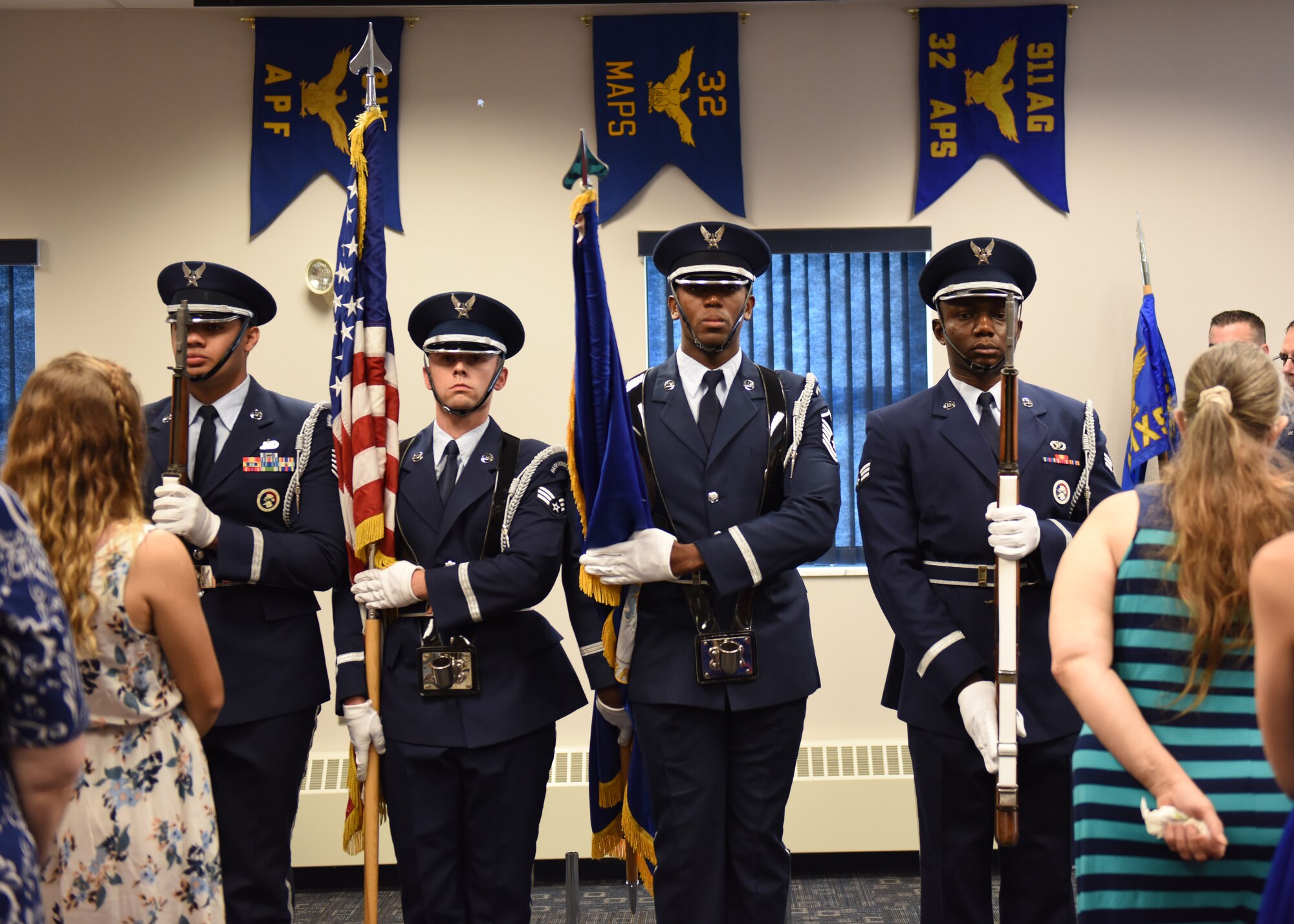 Airmen with the 911th Airlift Wing Honor Guard perform a flag ceremony during an assumption of command ceremony at the Pittsburgh International Airport Air Reserve Station, Pennsylvania Aug. 3, 2019.