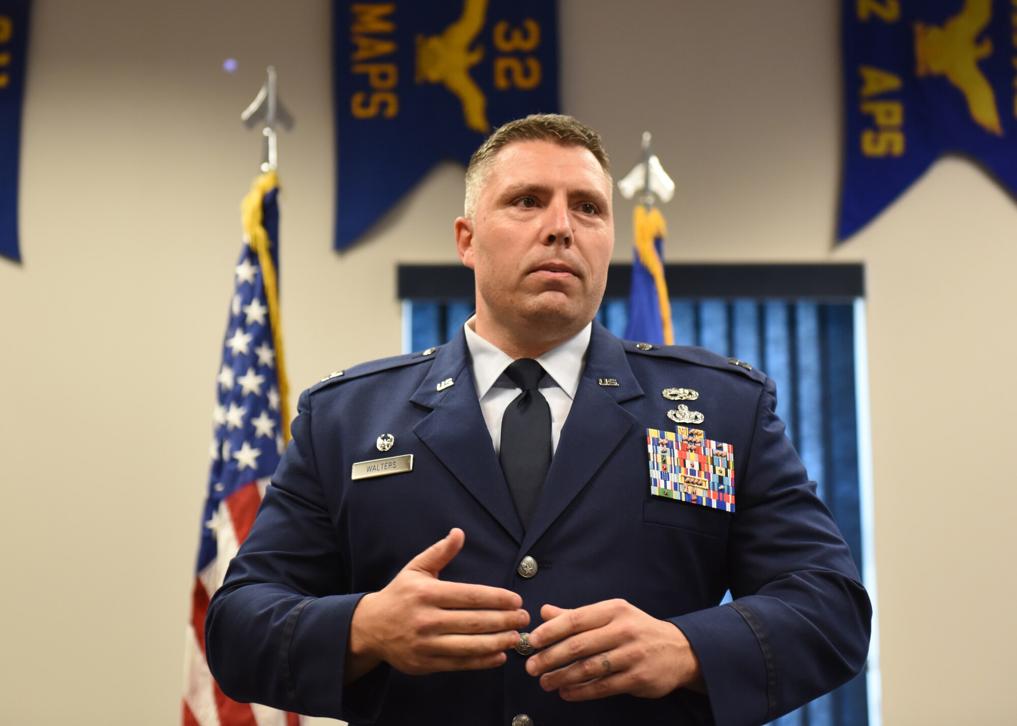 Capt. Joseph E. Walters, commander of the 911th Aircraft Maintenance Squadron, speaks to the 911th AMXS Airmen at his assumption of command ceremony at the Pittsburgh International Airport Air Reserve Station, Pennsylvania Aug. 3, 2019.