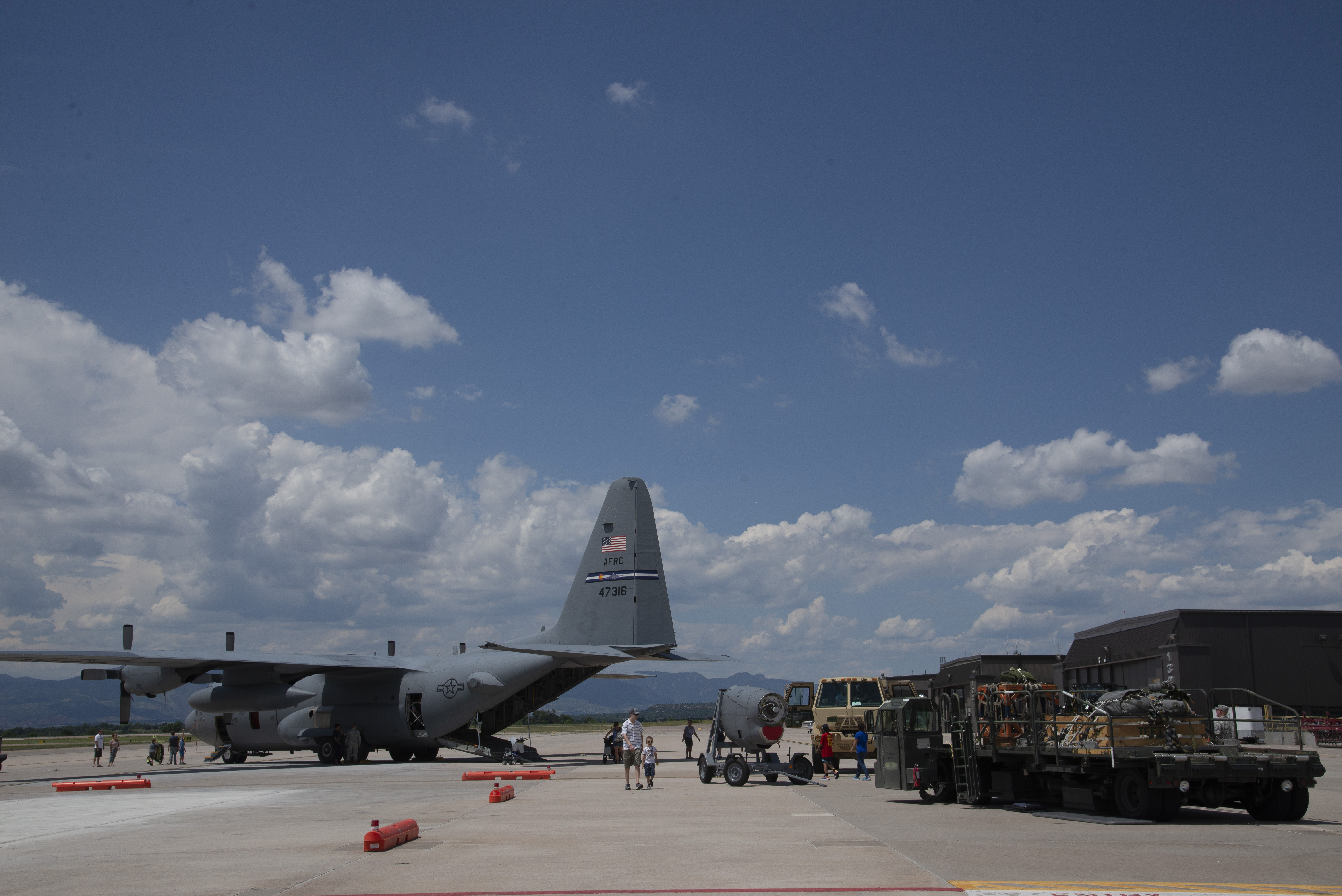 PETERSON AIR FORCE BASE, Colo. – Reserve Citizen Airmen with the 302nd Airlift Wing and their families tour a C-130 Hercules aircraft and equipment during the wing’s annual family day, Aug. 3, 2019, at Peterson Air Force Base, Colorado. Multiple units including the 39th Aerial Port Squadron, 302nd Maintenance Squadron, 731st Airlift Squadron and the 34th Aeromedical Evacuation Squadron provided equipment and subject matter experts for families to see and talk to during the event. (U.S. Air Force photo by Staff Sgt. Tiffany Lundberg)