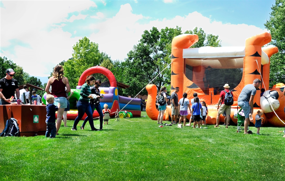 Members of the 302nd Airlift Wing and their families gather at the Capt. David Lyon Memorial Park during the Reserve wing’s annual family day event at Peterson Air Force Base, Colorado, Aug. 3, 2019. (U.S. Air Force photo by Tech. Sgt. Frank Casciotta)