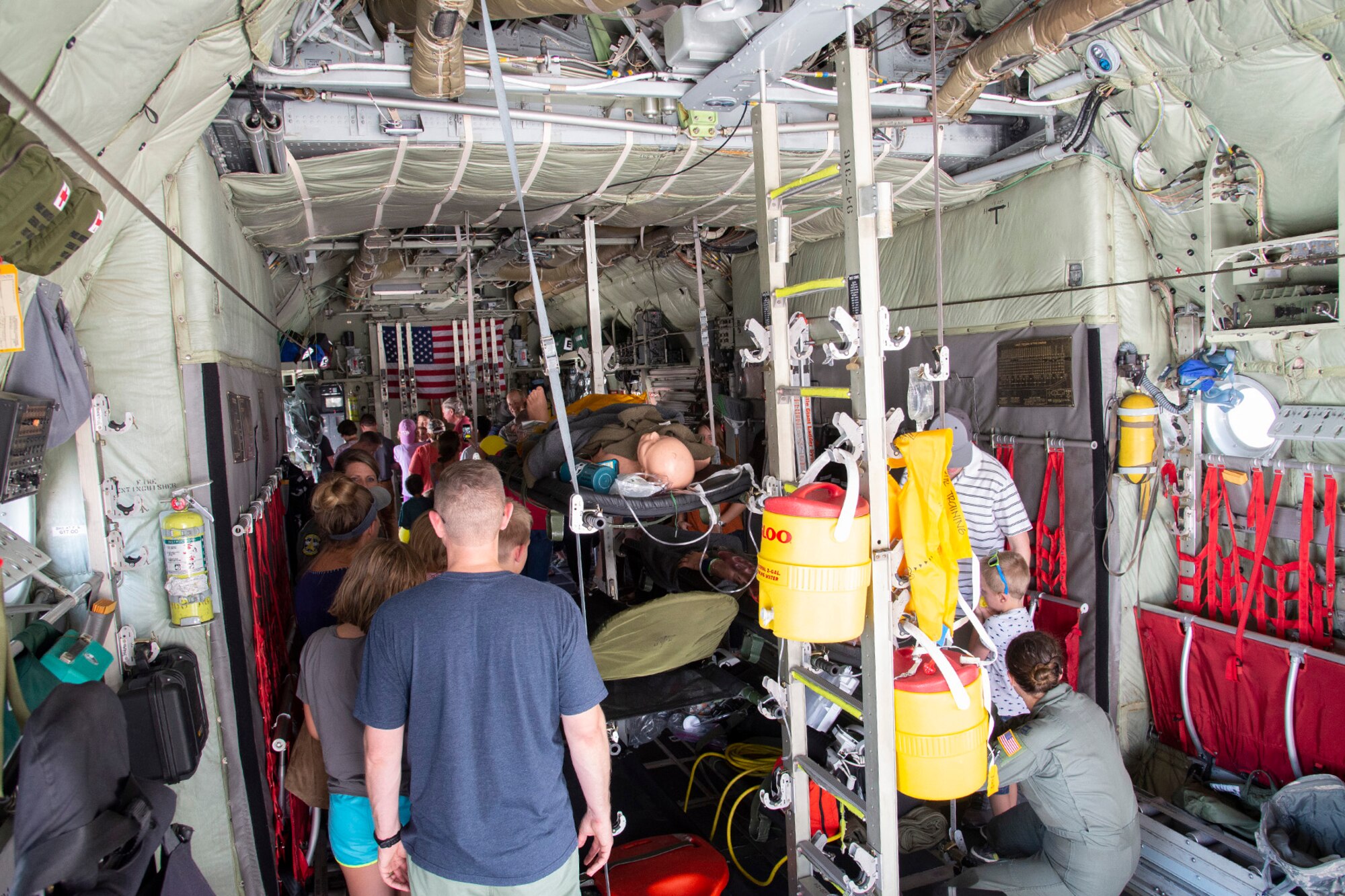 PETERSON AIR FORCE BASE, Colo. – Reserve Citizen Airmen with the 302nd Airlift Wing and their families tour a C-130 Hercules aircraft during the wing’s annual family day, Aug. 3, 2019, at Peterson Air Force Base, Colorado. Multiple units including the 39th Aerial Port Squadron, 302nd Maintenance Squadron, 731st Airlift Squadron and the 34th Aeromedical Evacuation Squadron provided equipment and subject matter experts for families to see and talk to during the event. (U.S. Air Force photo by Staff Sgt. Tiffany Lundberg)
