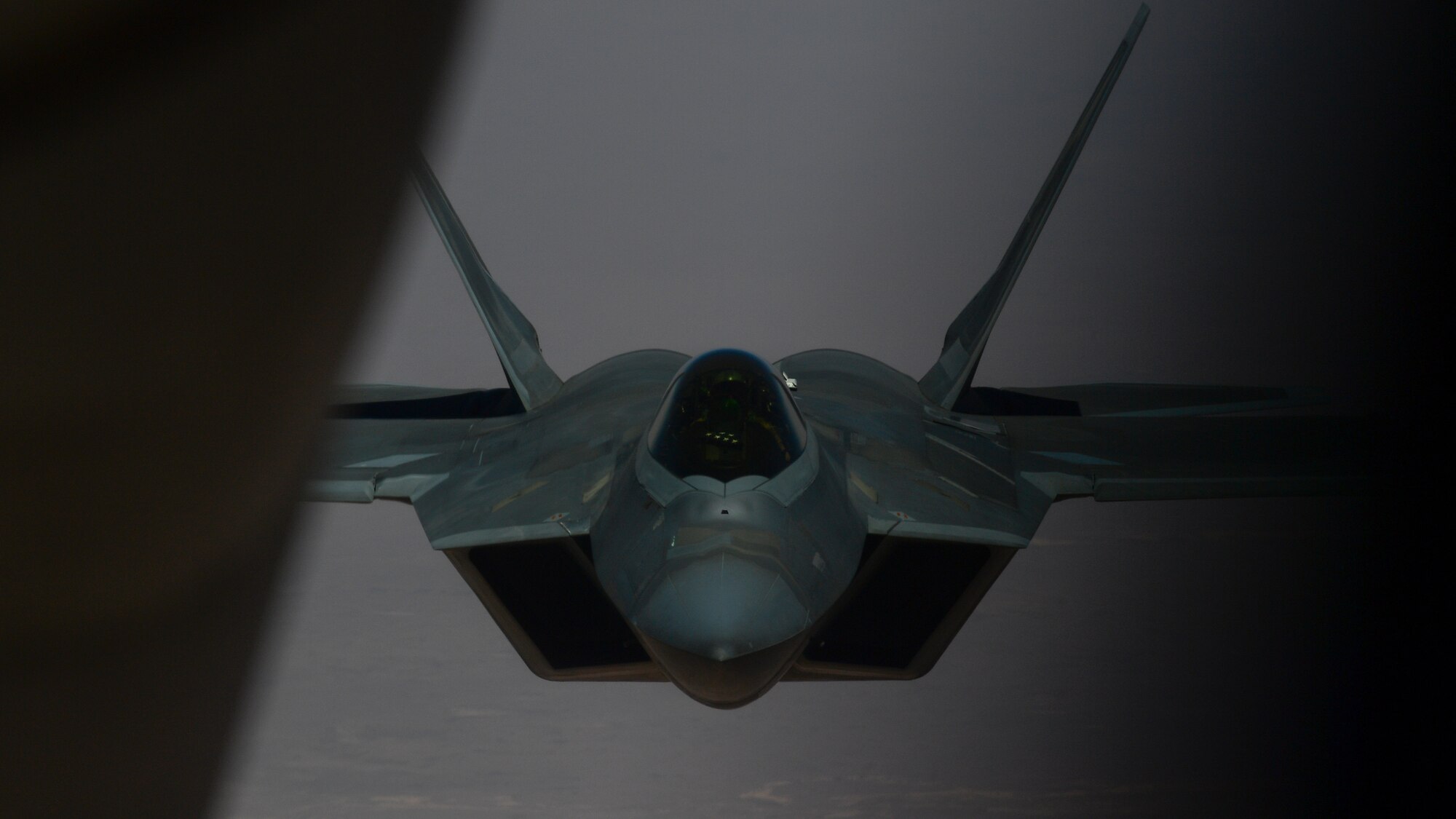 A photo of an F-22 moving in to receive fuel from a KC-135