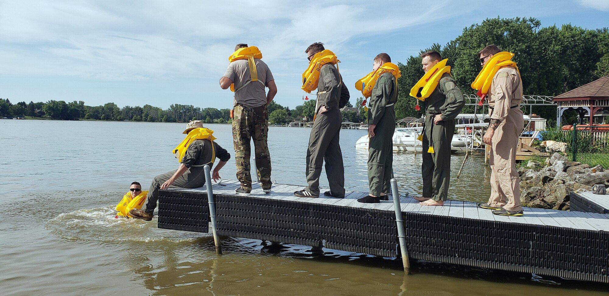 Reserve Citizen Airmen practice coordinated swimming techniques to stay warm and afloat during Survival, Evasion, Resistance and Escape training at Choctaw Lake in London, Ohio July 14, 2019