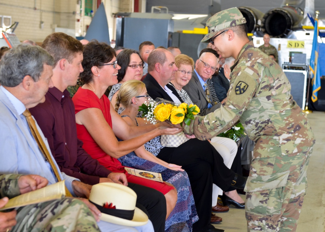 Spc. _________ presents flowers to Nancy Mosser, the wife of Maj. Gen. Gregg Mosser, during a change of command ceremony for the 377th Theater Sustainment Command at Naval Air Station Joint Reserve Base New Orleans August 3, 2019.