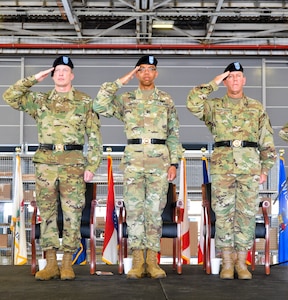 U.S. Army Reserve Command Deputy Commanding General Maj. Gen. A.C. Roper, center, salutes along with the incoming commander of the 377th Theater Sustainment Command, Maj. Gen. Greg Mosser, left, and outgoing commander, Maj. Gen. Steven Ainsworth, right,  during a change of command ceremony at Naval Air Station Joint Reserve Base New Orleans August 3, 2019.