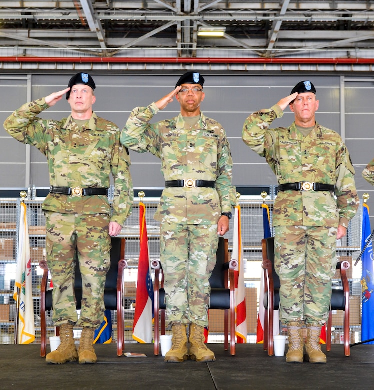 U.S. Army Reserve Command Deputy Commanding General Maj. Gen. A.C. Roper, center, salutes along with the incoming commander of the 377th Theater Sustainment Command, Maj. Gen. Greg Mosser, left, and outgoing commander, Maj. Gen. Steven Ainsworth, right,  during a change of command ceremony at Naval Air Station Joint Reserve Base New Orleans August 3, 2019.