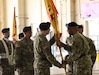 U.S. Army Reserve Command Deputy Commanding General, Maj. Gen. A.C. Roper, passes the 377th Theater Sustainment Command colors to Maj. Gen. Greg Mosser,  during a change of command ceremony at Naval Air Station Joint Reserve Base New Orleans, Belle Chasse, La.