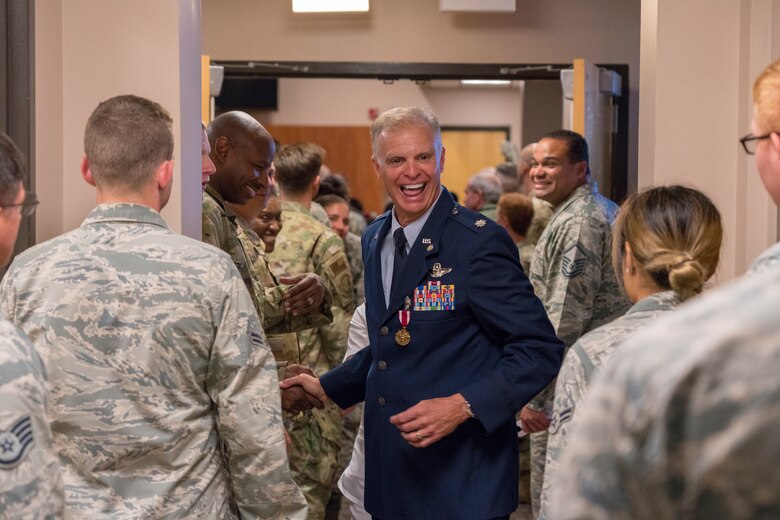 Lt. Col. Keith Gibson, 403rd Wing Operations Group deputy commander, exits the 815th Airlift Squadron auditorium at the end of his retirement ceremony Aug. 3, 2019 at Keesler Air Force Base, Mississippi. Gibson completed his Air Force career with 29 years of service. (U.S. Air Force photo by Tech. Sgt. Christopher Carranza)