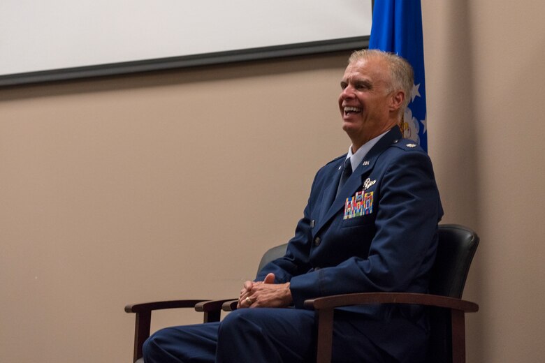 Lt. Col. Keith Gibson, 403rd Wing Operations Group deputy commander, laughs during his retirement ceremony Aug. 3, 2019 at Keesler Air Force Base, Mississippi. Throughout his tenure with the wing he had various positions such as the 815th Airlift Squadron’s assistant director of operations, 53rd Weather Reconnaissance Squadron’s director of operations, and 746th Expeditionary AS commander. (U.S. Air Force photo by Tech. Sgt. Christopher Carranza)