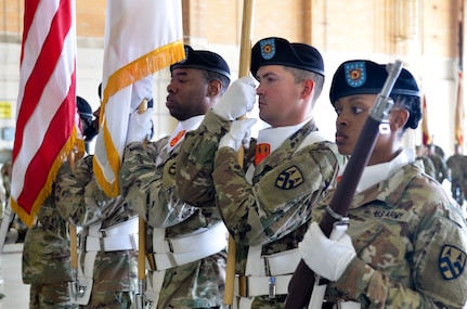 Members of the 377th Theater Sustainment Command color guard stand at attention during a change of command ceremony at NAS JRB New Orleans, Belle Chasse, La., August 3, 2019.