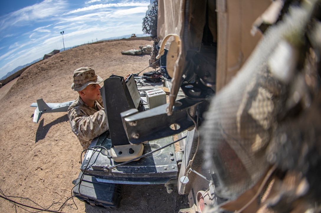 U.S. Marine Corps Lance Cpl. Harrison Dayton, an intelligence specialist with 1st Battalion, 25th Marine Regiment, 4th Marine Division, troubleshoots the RQ-20 Puma Unmanned Aerial System on a toughbook laptop at Marine Corps Air Ground Combat Center Twentynine Palms, Calif., July 31, 2019, during Integrated Training Exercise 5-19. Reserve Marines with 1/25 participate in ITX to prepare for their upcoming deployment to the Pacific Region. (U.S. Marine Corps photo by Sgt. Andy O. Martinez)