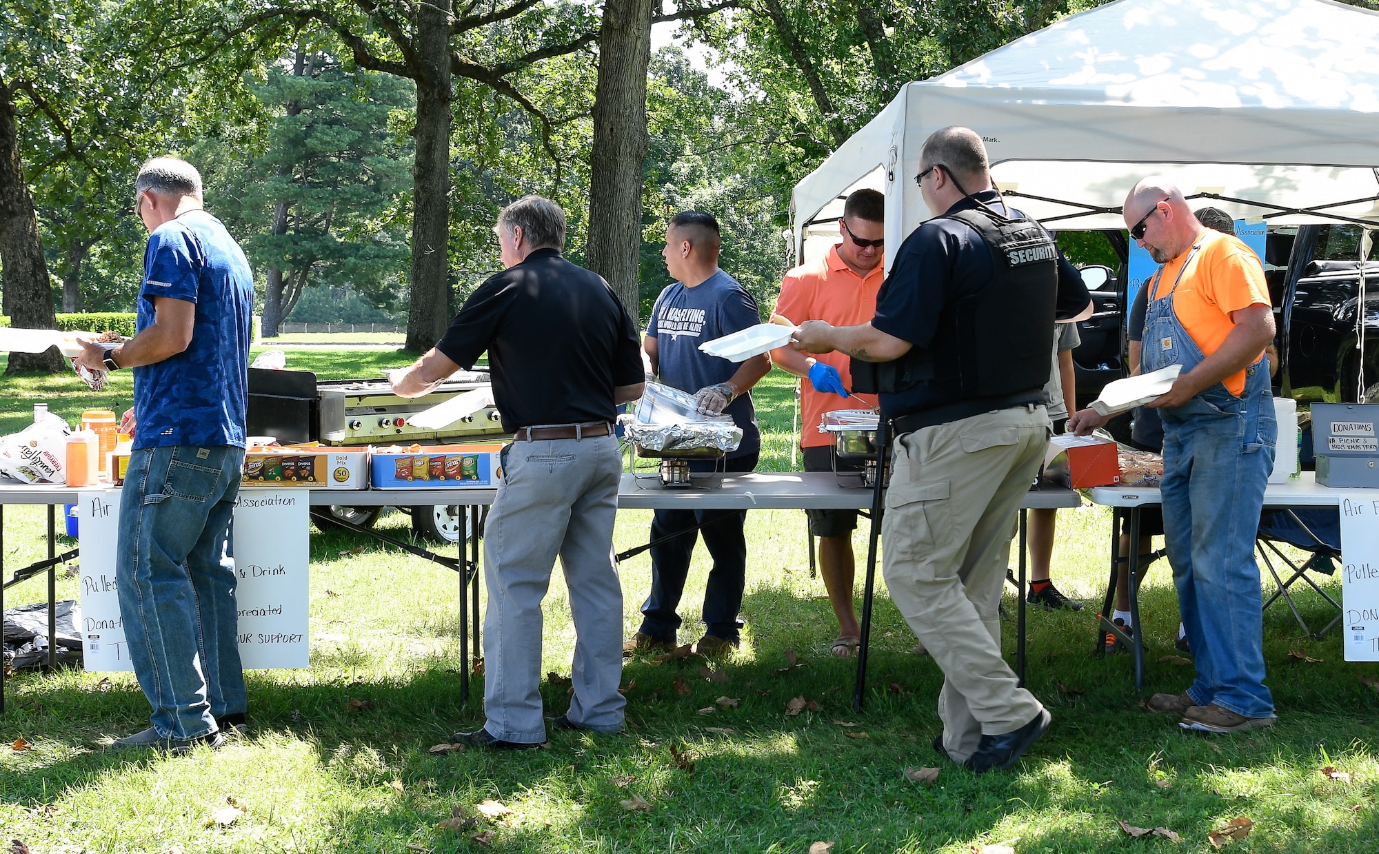 Air Force Sergeant's Association Chapter 477 serves up pulled pork and sides July 26 during a joint event with the Arnold Air Force Base Junior Force Council at Arnold. Funds raised by the AFSA chapter are used to support community events such as the Military Appreciation Day and the AEDC Children's Christmas Party. (U.S. Air Force photo by Jill Pickett)