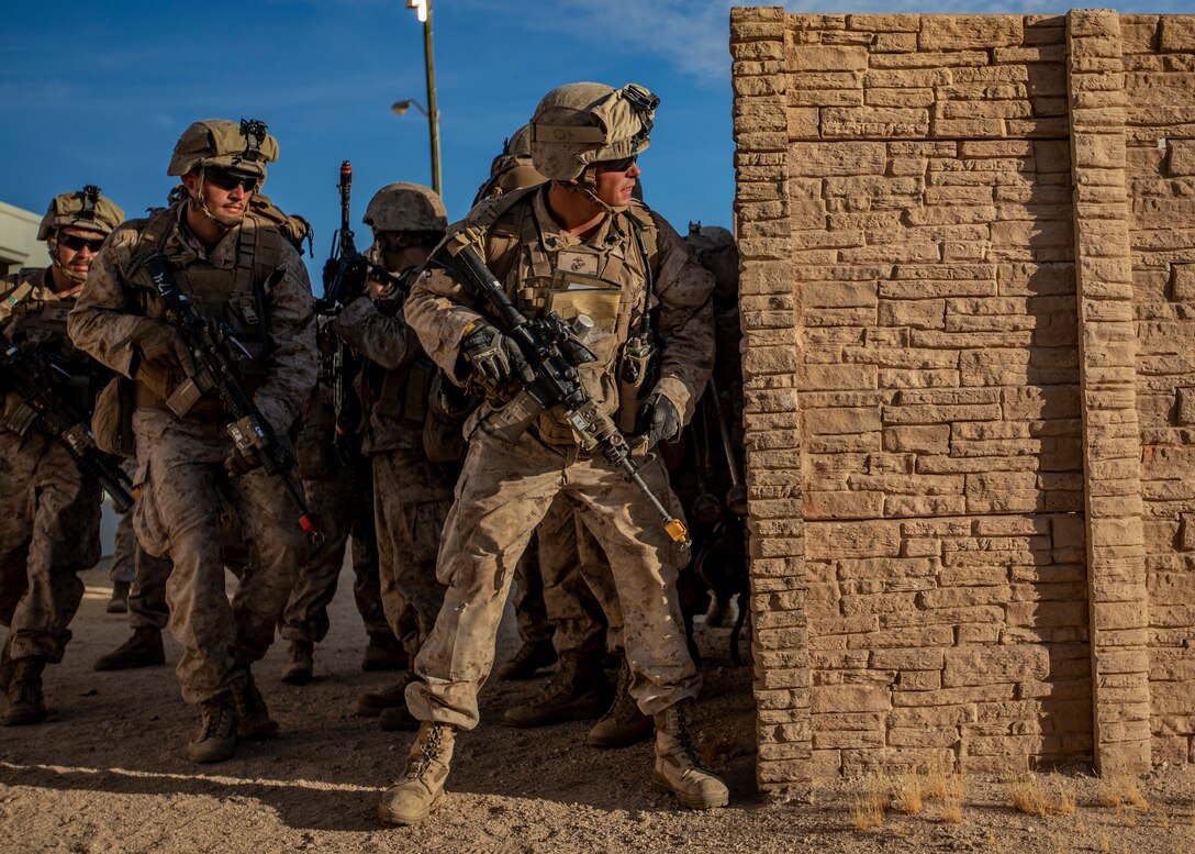 U.S. Marines with 1st Battalion, 25th Marine Regiment, 4th Marine Division, prepare to rush to an objective during Integrated Training Exercise 5-19 at Marine Corps Air Ground Combat Center Twentynine Palms, Calif., July 31, 2019. Reserve Marines with 1/25 participate in ITX to prepare for their upcoming deployment to the Pacific Region. (U.S. Marine Corps photo by Lance Cpl. Jose Gonzalez)