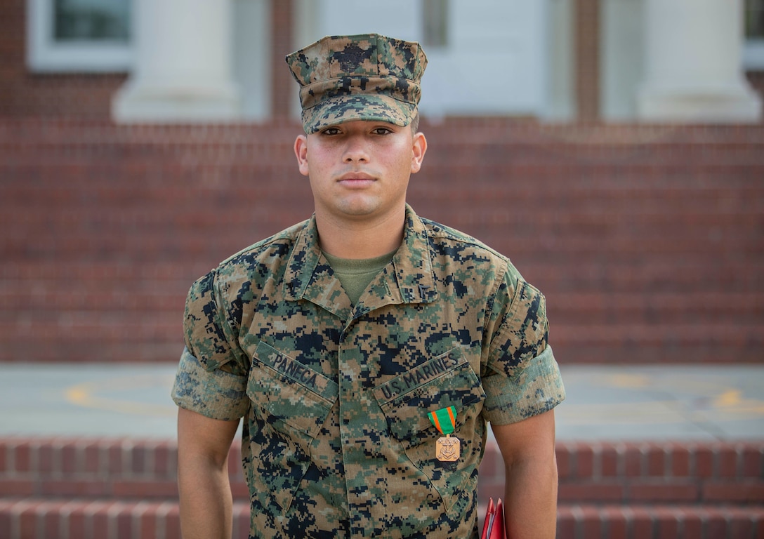 Lance Cpl. Angel Paneca is awarded a Navy and Marine Corps Achievement Medal by Headquarters and Service Battalion Commanding Officer Col. Sean C. Kileen at an awards ceremony on Parris Island, S.C. Aug. 1st, 2019. 
(U.S. Marine Corps photo by Lance Cpl. Dylan Walters)