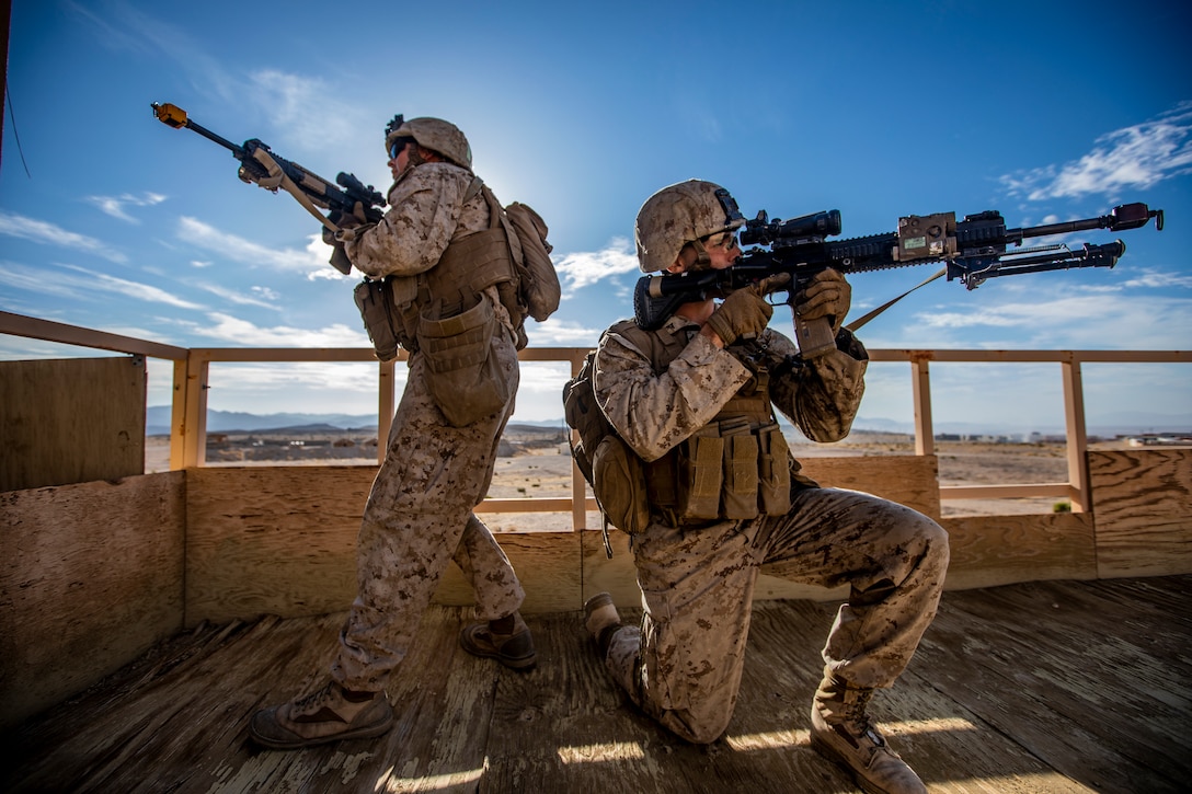 U.S. Marine Corps Cpl. Tyler Tobin, left, and Lance Cpl. David Cataldo, right, both infantry riflemen with 1st Battalion, 25th Marine Regiment, 4th Marine Division, post security during Integrated Training Exercise 5-19 at Marine Corps Air Ground Combat Center Twentynine Palms, Calif., July 31, 2019. Reserve Marines with 1/25 participate in ITX to prepare for their upcoming deployment to the Pacific Region. (U.S. Marine Corps photo by Lance Cpl. Jose Gonzalez)