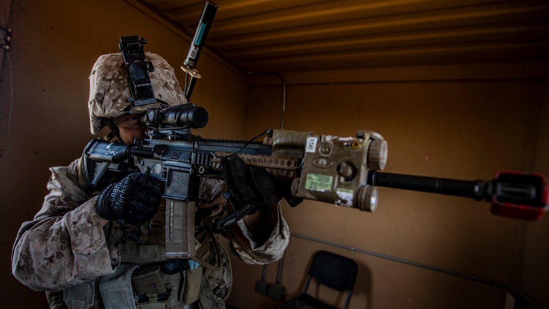 U.S. Marine Corps Lance Cpl. Elton Sawyer, an infantry rifleman with 1st Battalion, 25th Marine Regiment, 4th Marine Division, engages with simulated hostiles during Integrated Training Exercise 5-19 at Marine Corps Air Ground Combat Center Twentynine Palms, Calif., July 31, 2019. Reserve Marines with 1/25 participate in ITX to prepare for their upcoming deployment to the Pacific Region. (U.S. Marine Corps photo by Lance Cpl. Jose Gonzalez)
