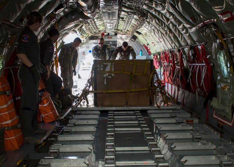 Aircrew load cargo onto a KC-135 Stratotanker during a cargo load training at Fairchild Air Force Base, Washington, Oct. 17, 2018. (U.S. Air Force photo/Airman 1st Class Whitney Laine)