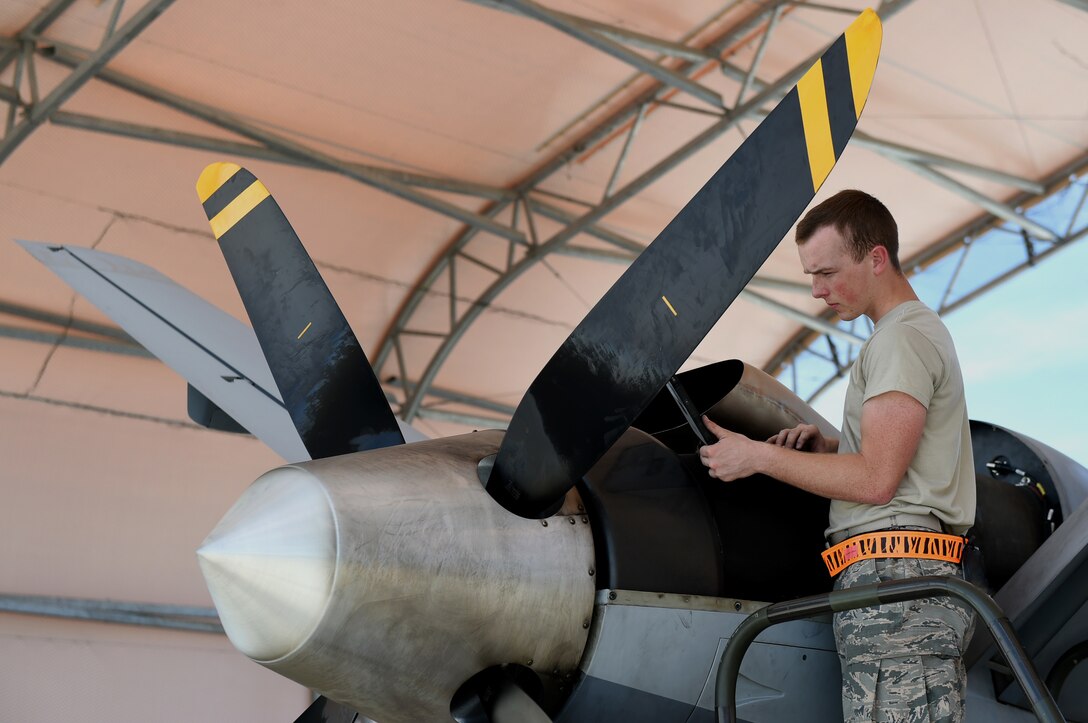Airman Jacob, 432nd Aircraft Maintenance Squadron crew chief, conducts maintenance on an MQ-9 Reaper at Creech Air Force Base, Nevada, July 2, 2019.  (U.S. Air Force photo by Airman 1st Class William Rosado)