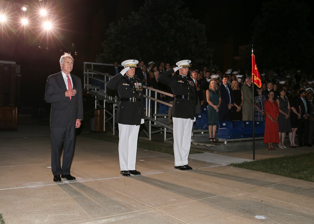 From left, the Secretary of the Navy, the Honorable Richard V. Spencer, Commandant of the Marine Corps Gen. David H. Berger, and Col. Donald J. Tomich, commanding officer, Marine Barracks Washington, D.C., render honors for the “honors” sequence during a Friday Evening Parade at Marine Barracks Washington, D.C., August 2, 2019. General Berger was the hosting official and Mr. Spencer was the guest of honor for the evening. (U.S. Marine Corps photo by Cpl. James Bourgeois/Released)
