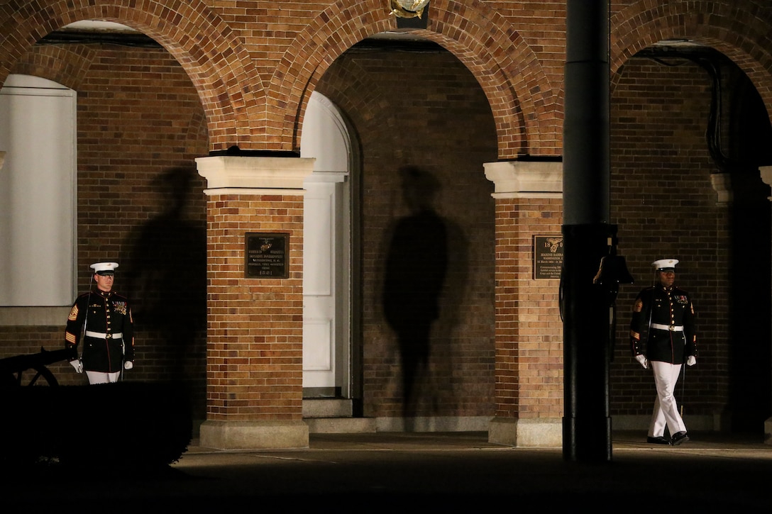 Alpha and Bravo Company first sergeants march onto the parade deck for the “report” sequence during a Friday Evening Parade at Marine Barracks Washington, D.C., August 2, 2019. The Commandant of the Marine Corps Gen. David H. Berger was the hosting official and the Secretary of the Navy, the Honorable Richard V. Spencer, was the guest of honor for the evening. (U.S. Marine Corps photo by Sgt. Robert Knapp/Released)