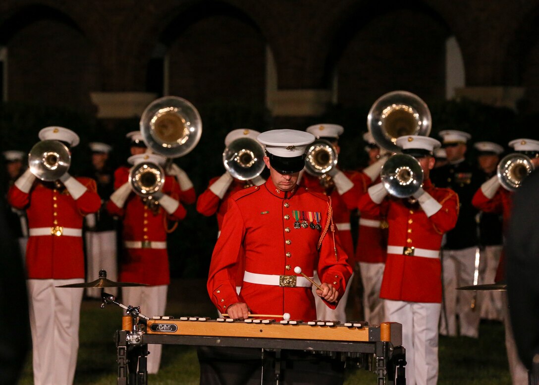 Marines with “The Commandant’s Own” U.S. Marine Drum and Bugle Corps conduct a musical ballad during a Friday Evening Parade at Marine Barracks Washington, D.C., August 2, 2019. The Commandant of the Marine Corps Gen. David H. Berger was the hosting official and the Secretary of the Navy, the Honorable Richard V. Spencer, was the guest of honor for the evening. (U.S. Marine Corps photo by Sgt. Robert Knapp/Released)