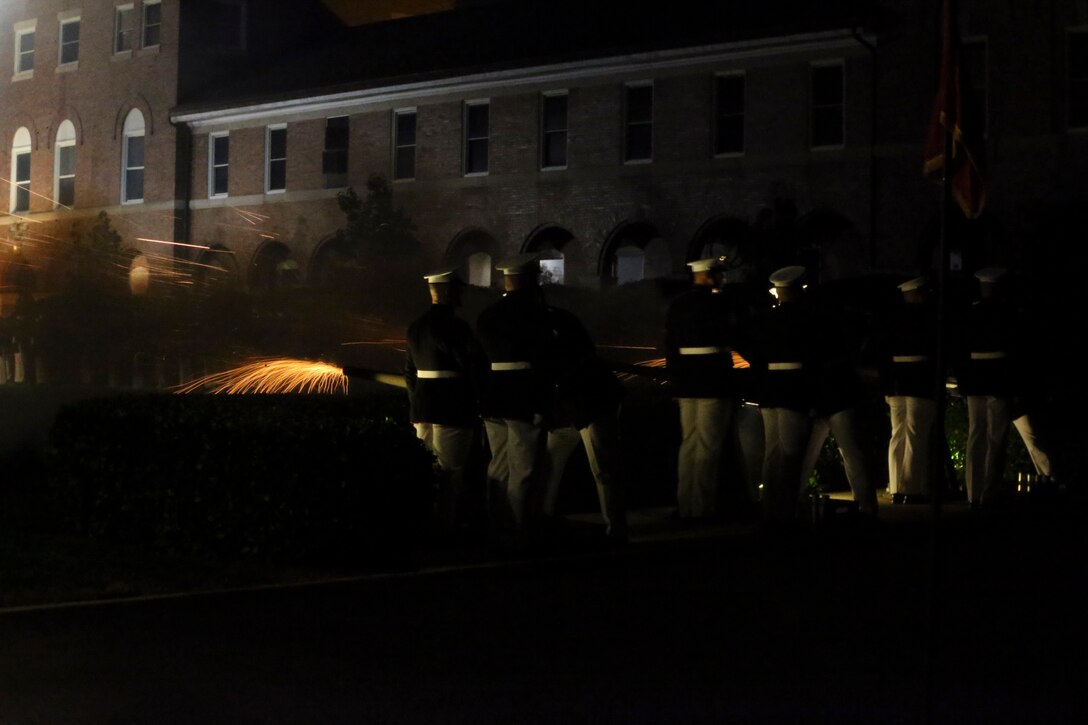 Marines with the Body Bearer section, Bravo Company, Marine Barracks Washington, D.C., fire cannons during a Friday Evening Parade at Marine Barracks Washington, D.C., August 2, 2019. The Commandant of the Marine Corps Gen. David H. Berger was the hosting official and the Secretary of the Navy, the Honorable Richard V. Spencer, was the guest of honor for the evening. (U.S. Marine Corps photo by Sgt. Robert Knapp/Released)