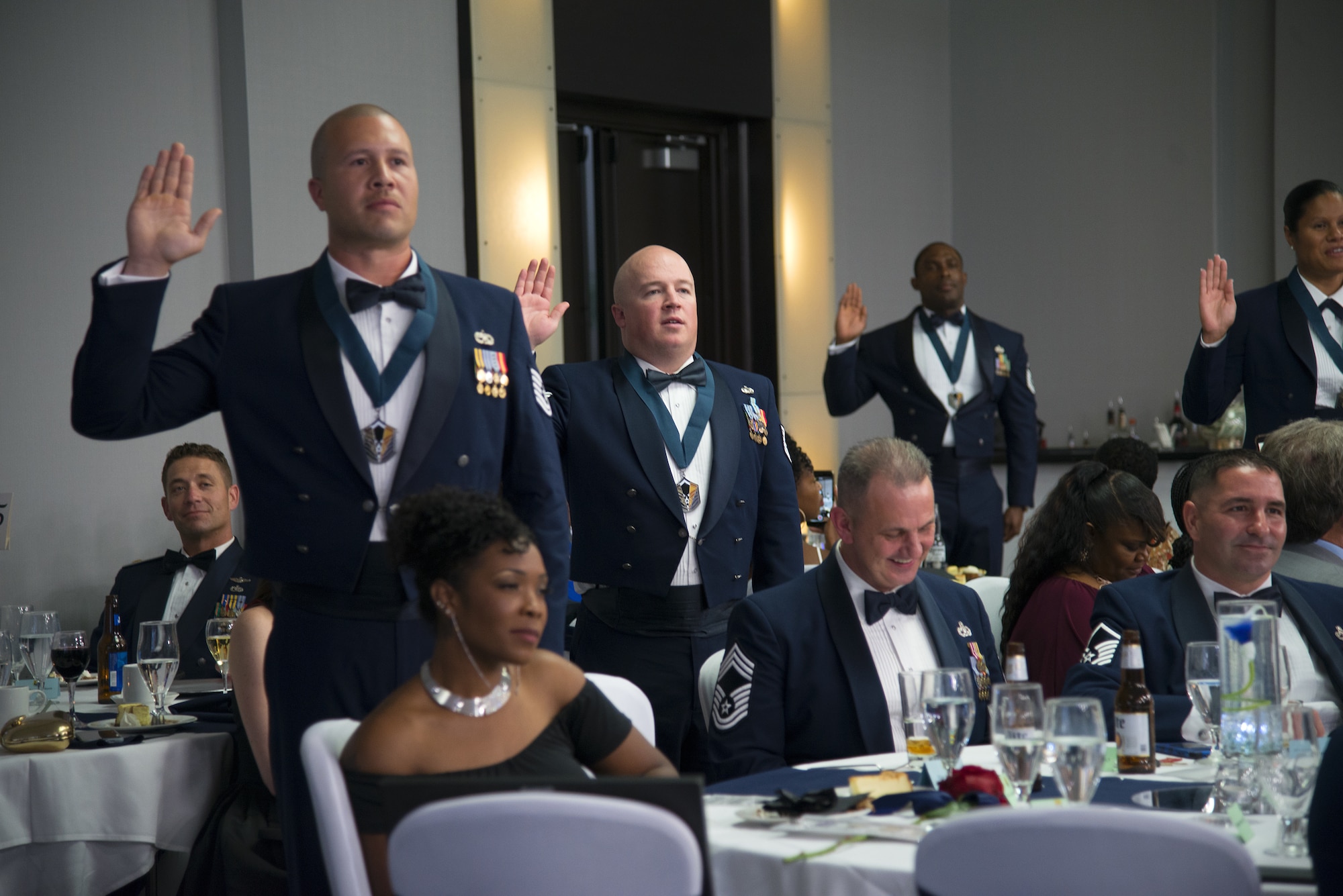 Master Sgt. selects recite the SNCO charge during a SNCO Induction Ceremony at Hotel Alba in Tampa, Fla., Aug 2, 2019. The induction ceremony inductees attended the SNCO Professional Enhancement Seminar to better prepare themselves for their new responsibilities.