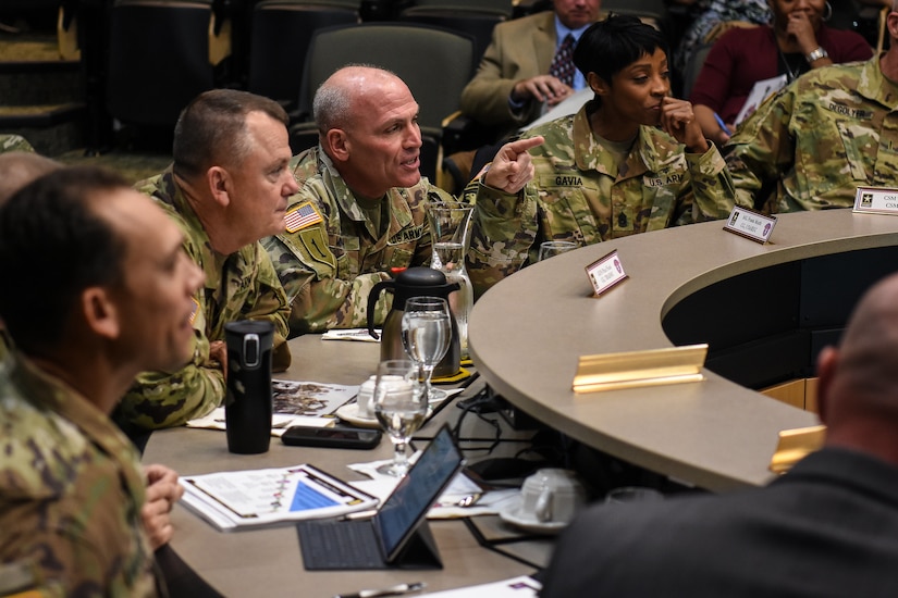 Maj. Gen. Frank Muth, commanding general of U.S. Army Recruiting Command, and the USAREC primary staff present Gen. Paul Funk II, commanding general of U.S. Army Training and Doctrine Command, with an introductory brief to the command. This was Funk's first visit to USAREC since taking command of TRADOC and his first in-depth look at recruiting operations. (U.S. Army photo by Lara Poirrier)