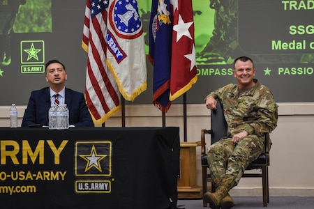 Medal of Honor Recipient Staff Sgt. David Bellavia (left) and Gen. Paul Funk II, commanding general of U.S. Army Training and Doctrine Command (right), answer questions from U.S. Army Recruiting and Retention College students at Hazard Auditorium, Fort Knox, Kentucky July 31. Funk opened the floor to questions following a motivational speech given by Bellavia about the importance of recruiting. (U.S. Army Photo by Lara Poirrier)