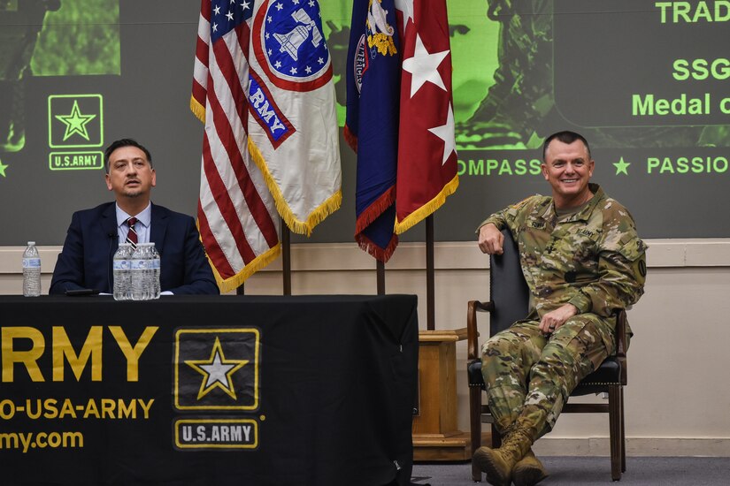 Medal of Honor Recipient Staff Sgt. David Bellavia (left) and Gen. Paul Funk II, commanding general of U.S. Army Training and Doctrine Command (right), answer questions from U.S. Army Recruiting and Retention College students at Hazard Auditorium, Fort Knox, Kentucky July 31. Funk opened the floor to questions following a motivational speech given by Bellavia about the importance of recruiting. (U.S. Army Photo by Lara Poirrier)