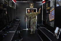 Gen. Paul Funk II, commanding general of U.S. Army Training and Doctrine Command, receives a tour of the mobile recruiting trailer during his visit to the Marketing Engagement Brigade headquarters at Fort Knox, Kentucky, Aug. 1. The mobile recruiting trailer is just one of the mobile army exhibits the Mobile Exhibit Company, Mission Support Battalion, deploys around the country to support recruiting operations. (U.S. Army photo by Lara Poirrier)