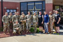 Gen. Paul Funk II, commanding general of U.S. Army Training and Doctrine Command, and Medal of Honor Recipient Staff Sgt. David Bellavia take a photo with Soldiers of the U.S. Army Marketing Engagement Brigade at the end of their visit to the brigade headquarters at Fort Knox, Kentucky, Aug. 1. During their visit, Funk and Bellavia had the opportunity to meet members of the U.S. Army Outreach Company, which owns the Musical Outreach Team, the Army Warrior Fitness Team, and the Army Esports Team. These teams have the task of supporting recruiting operations by generating public interest in the U.S. Army as they engage in activities and travel around the U.S. (U.S. Army photo by Lara Poirrier)