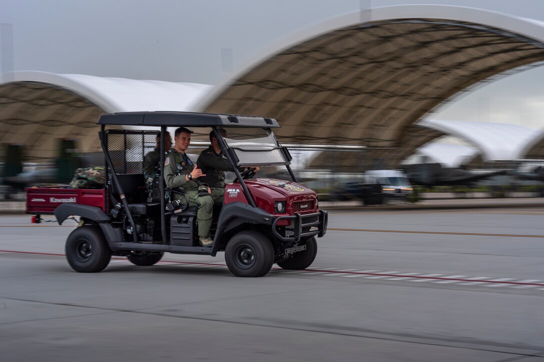 Airmen from the 74th Fighter Squadron (FS) drive on the flightline before departing for Jaded Thunder, Aug. 2, 2019, at Moody Air Force Base, Ga. Jaded Thunder is a joint services exercise to complete training requirements and prepare for future deployments. It includes joint forces integration by members of U.S. Air Force, Marine Corps, Navy and Army units, as well as representatives of the U.S. Special Operations Command. (U.S. Air Force photo by Airman 1st Class Hayden Legg)
