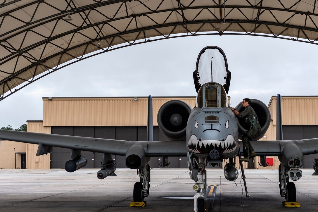 Maj. Adam Peterson, 74th Fighter Squadron (FS) A-10C Thunderbolt II pilot, climbs into an A-10 before departing for Jaded Thunder, Aug. 2, 2019, at Moody Air Force Base, Ga. Jaded Thunder is a joint services exercise to complete training requirements and prepare for future deployments. It includes joint forces integration by members of U.S. Air Force, Marine Corps, Navy and Army units, as well as representatives of the U.S. Special Operations Command. (U.S. Air Force photo by Airman 1st Class Hayden Legg)