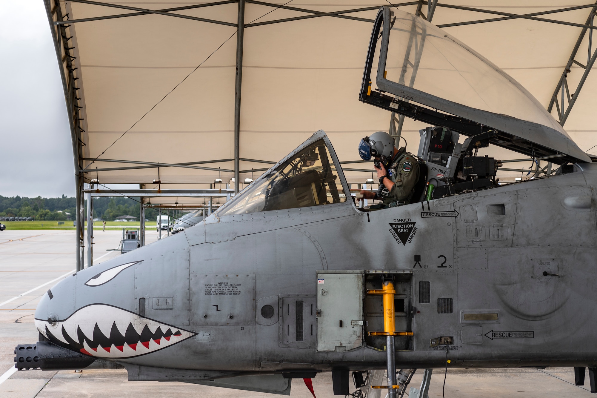 Maj. Adam Peterson, 74th Fighter Squadron (FS) A-10C Thunderbolt II pilot, adjusts his mask before departing for Jaded Thunder, Aug. 2, 2019, at Moody Air Force Base, Ga. Jaded Thunder is a joint services exercise to complete training requirements and prepare for future deployments. It includes joint forces integration by members of U.S. Air Force, Marine Corps, Navy and Army units, as well as representatives of the U.S. Special Operations Command. (U.S. Air Force photo by Airman 1st Class Hayden Legg)