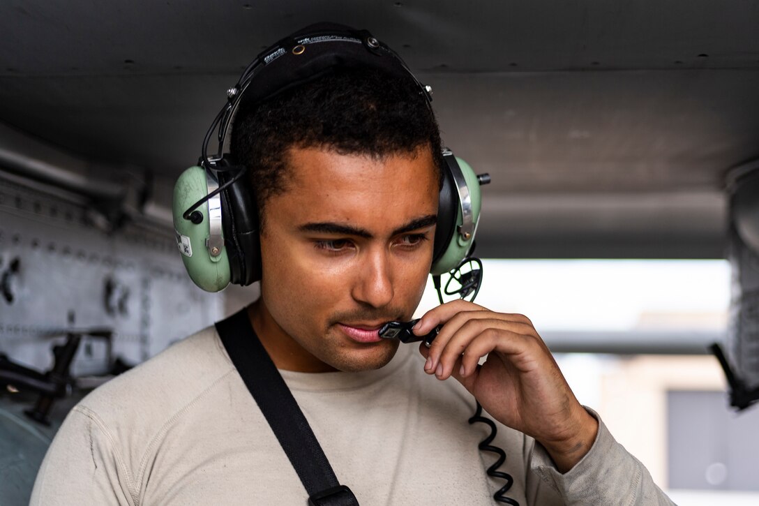 Senior Airman Kyle Reed, 74th Aircraft Maintenance Unit (AMU) crew chief, talks to a pilot during a pre-flight check in preparation to depart for Jaded Thunder, Aug. 2, 2019, at Moody Air Force Base, Ga. Jaded Thunder is a joint services exercise to complete training requirements and prepare for future deployments. It includes joint forces integration by members of U.S. Air Force, Marine Corps, Navy and Army units, as well as representatives of the U.S. Special Operations Command. (U.S. Air Force photo by Airman 1st Class Hayden Legg)