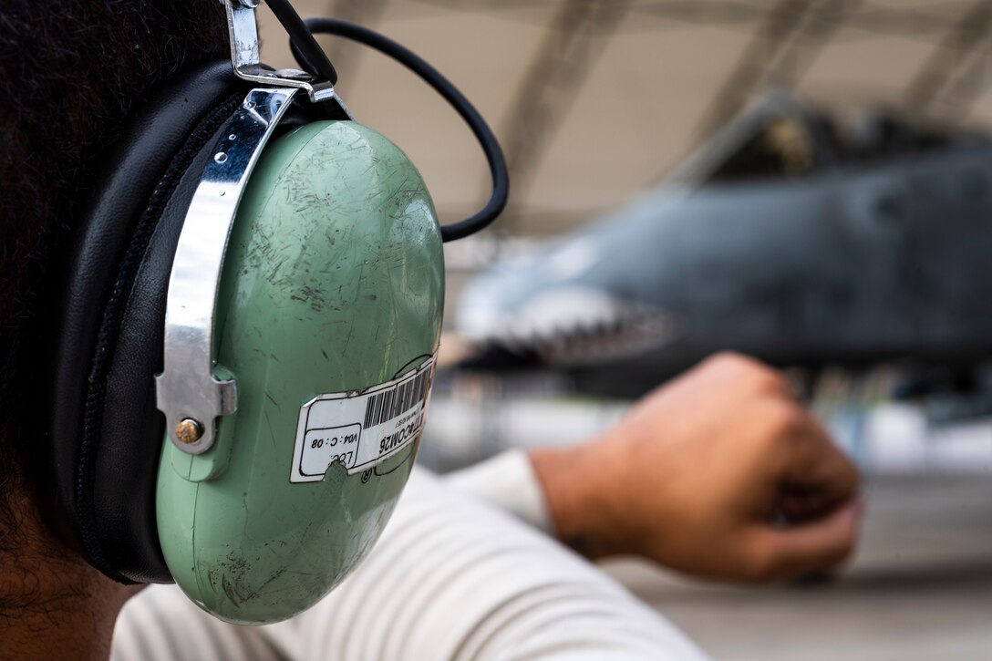 Senior Airman Kyle Reed, 74th Aircraft Maintenance Unit (AMU) crew chief, pulls chocks from an A-10C Thunderbolt II before the aircraft leaves for Jaded Thunder, Aug. 2, 2019, at Moody Air Force Base, Ga. Jaded Thunder is a joint services exercise to complete training requirements and prepare for future deployments. It includes joint forces integration by members of U.S. Air Force, Marine Corps, Navy and Army units, as well as representatives of the U.S. Special Operations Command. (U.S. Air Force photo by Airman 1st Class Hayden Legg)