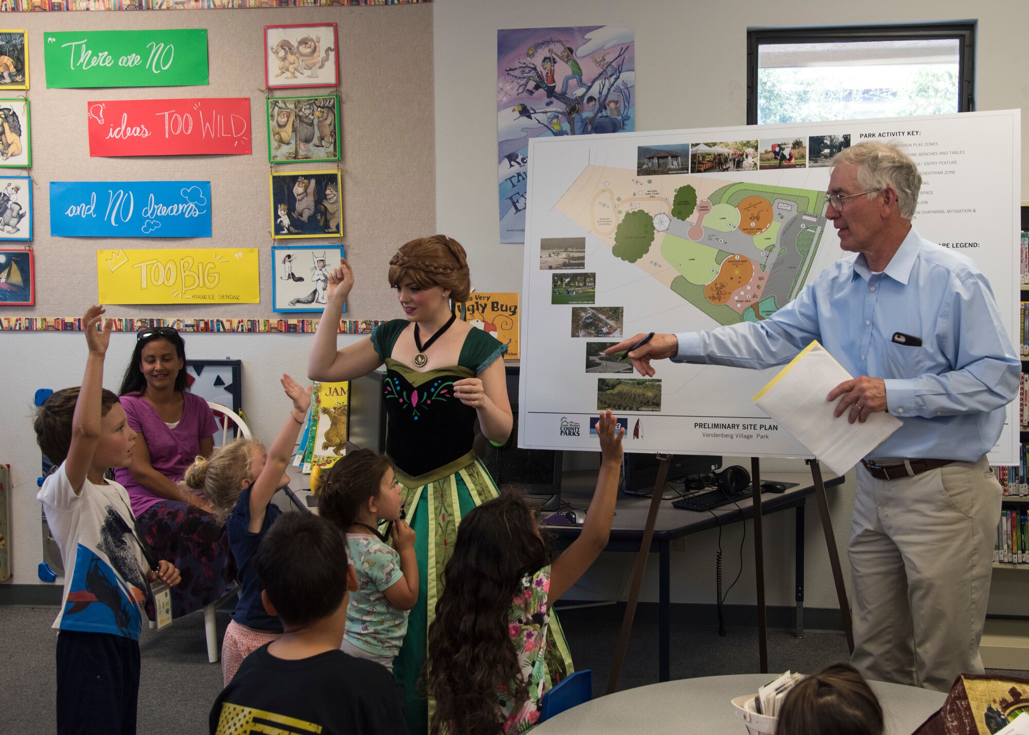 Staff Sgt. Erica Darcy, 614th Air Operation Center intelligence analyst, volunteers as a princess actor during a book reading at a local library June 24, 2019, in Vandenberg Village, Calif.