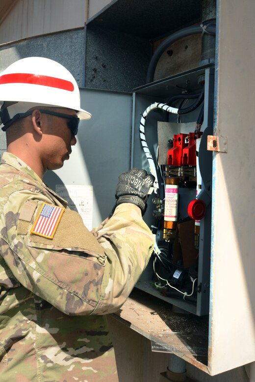 As a culmination of months of training and preparation, the 249th Engineer Battalion (Alpha Company) 3rd Power Station Prime Power Specialist Staff Sgt. Jason Pallack and his partner Pfc. Jason D. Pallack conduct a simulated power outage June 21.